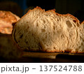 Artisan Bread Slice Close-up Showing Airy Crumb Texture on Wooden Board 137524788