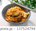 Khao Soi Northern Thai Curry Noodle Soup with Crispy Noodles in Bowl 137524794