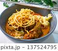 Khao Soi Northern Thai Curry Noodle Soup with Crispy Noodles in Bowl 137524795