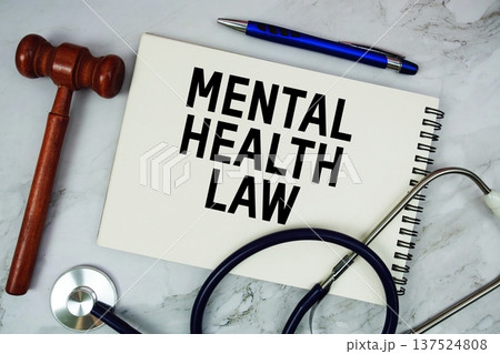 Mental Health Law text written on notepad with stethoscope and gavel on marble background Mental Health Law text written on notepad with stethoscope and gavel on marble background 137524808