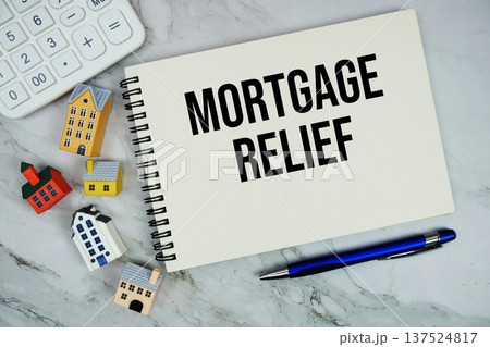 Mortgage Relief text written on notepad with house model on marble background Mortgage Relief text written on notepad with house model on marble background 137524817