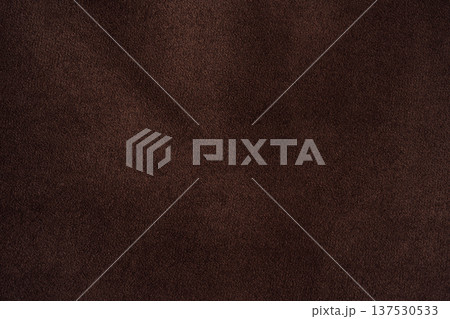 Dark brown suede texture background with subtle shading, minimal leather backdrop Dark brown suede texture background with subtle shading, minimal leather backdrop 137530533