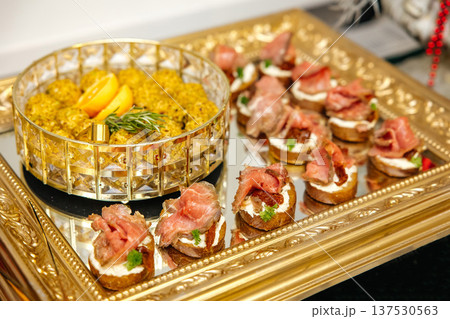 Appetizer platter serving roast beef bruschetta and cheese balls Appetizer platter serving roast beef bruschetta and cheese balls 137530563