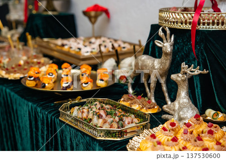 Festive holiday buffet table offering delicious gourmet appetizers 137530600