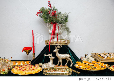 Christmas holiday catering buffet with festive appetizers and decorations Christmas holiday catering buffet with festive appetizers and decorations 137530611