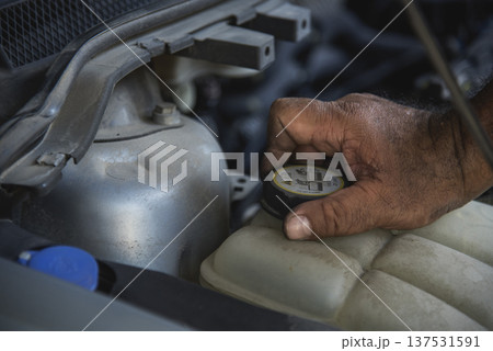 Close up Mechanic man hands repairing car auto repair shop uses jack change tyre. Man hands fixing Shock absorber machinery vehicle mechanical service. Vehicle Car overhaul maintenance engineer Close up Mechanic man hands repairing car auto repair shop uses jack change tyre. Man hands fixing Shock absorber machinery vehicle mechanical service. Vehicle Car overhaul maintenance engineer 137531591