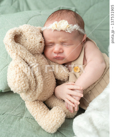 Calm infant resting in home environment with soft light and cozy atmosphere. Care focused scene supports lifestyle visuals and educational family related content. Calm infant resting in home environment with soft light and cozy atmosphere. Care focused scene supports lifestyle visuals and educational family related content. 137531905