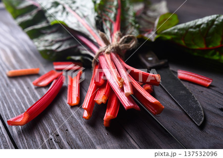 Bunch of Swiss chard with red stems and green leaves 137532096