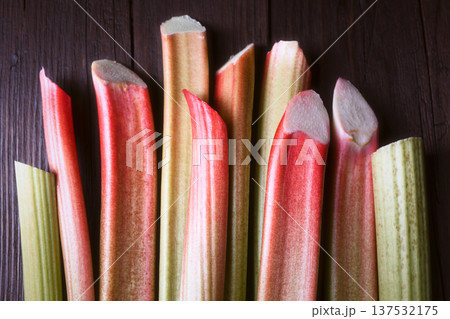Symmetrical arrangement of fresh rhubarb stalks Symmetrical arrangement of fresh rhubarb stalks 137532175