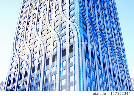 Glass fscade skyscraper tower background. Modern urban architecture facade patter. Glass fscade skyscraper tower background. Modern urban architecture facade patter. 137532344