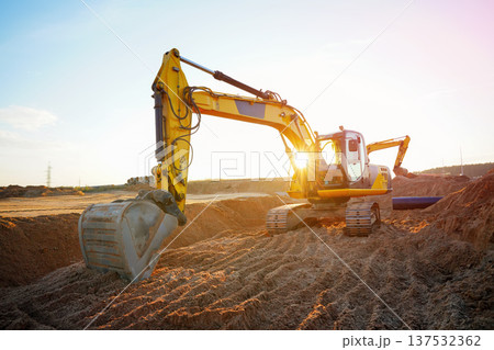 Excavator earthworks on construction site. Sewer line repair. Excavator groundwork water line repair Excavator earthworks on construction site. Sewer line repair. Excavator groundwork water line repair 137532362