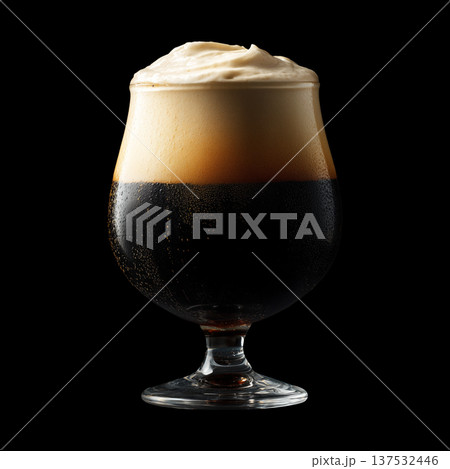 Foamy dark stout beer in a pint tulip glass with creamy foam head, isolated on black background, concept of refreshment and taste Foamy dark stout beer in a pint tulip glass with creamy foam head, isolated on black background, concept of refreshment and taste 137532446