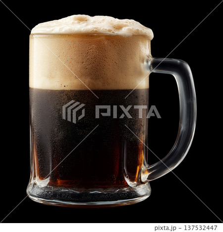 Foamy dark stout beer in a mug glass with creamy foam head, isolated on black background, concept of refreshment and taste Foamy dark stout beer in a mug glass with creamy foam head, isolated on black background, concept of refreshment and taste 137532447