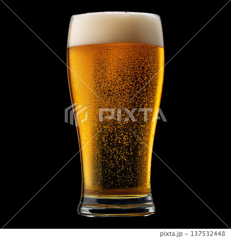 Foamy amber ale beer in a tall glass with creamy foam head, isolated on black background, concept of refreshment and taste Foamy amber ale beer in a tall glass with creamy foam head, isolated on black background, concept of refreshment and taste 137532448