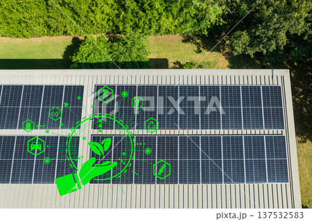 Solar photovoltaic panels on roof on a top of house . Concept of renewable energy home. Solar photovoltaic panels on roof on a top of house . Concept of renewable energy home. 137532583