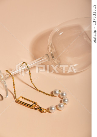 Refined Flatlay Showcasing Beads And Clasp. Chic Jewelry Arrangement With Soft Lighting And Shadows Refined Flatlay Showcasing Beads And Clasp. Chic Jewelry Arrangement With Soft Lighting And Shadows 137533315