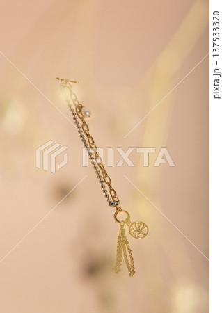 Refined Jewelry Piece Showcasing Pearl Pendant Against Soft Pink Setting With Vintage Elements 137533320