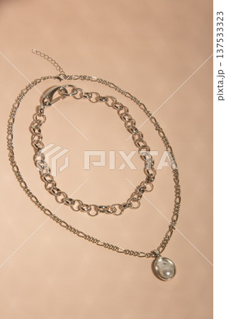 Artistic Presentation Of Layered Chains And Pearls Highlighting Tactile And Visual Elegance In Natural Light 137533323
