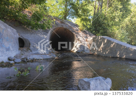 Large round sewage outlet contributing to coastal pollution Large round sewage outlet contributing to coastal pollution 137533820