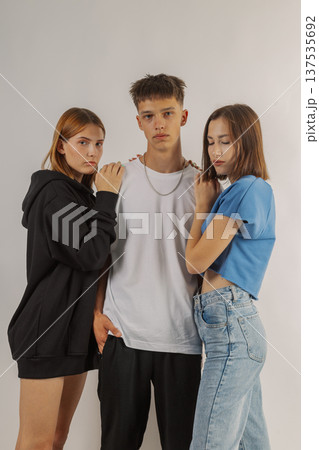 Group of young people in stylish clothes on white Group of young people in stylish clothes on white 137535692