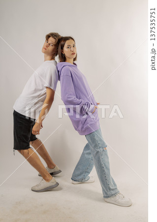 Beautiful young guy and girl in stylish clothes on 137535751