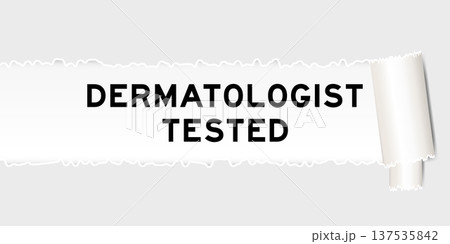 Ripped gray paper background that have word dermatologist tested under torn part Ripped gray paper background that have word dermatologist tested under torn part 137535842