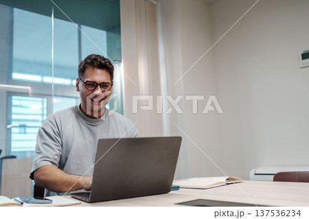 Man Coding Happily. White Male Software Engineer Concluding Productive Day With Contented Look Man Coding Happily. White Male Software Engineer Concluding Productive Day With Contented Look 137536234