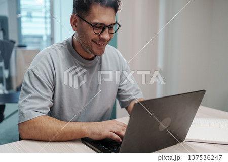 Male Expert Carefully Analyzing Charts And Documents In Professional Setting With Dedication Male Expert Carefully Analyzing Charts And Documents In Professional Setting With Dedication 137536247