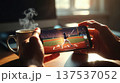 Watching Baseball on Smartphone With Morning Coffee 137537052
