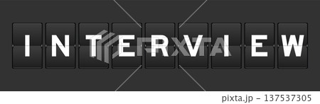 Black color analog flip board with word interview on gray background Black color analog flip board with word interview on gray background 137537305