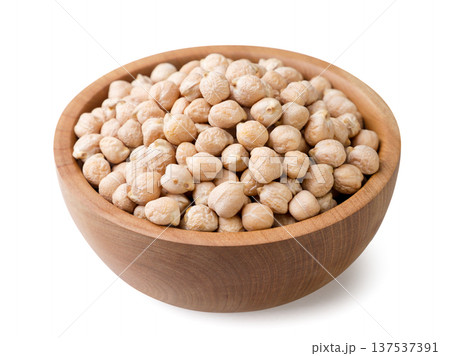 Raw chickpeas in a wooden plate on a white background. Isolated Raw chickpeas in a wooden plate on a white background. Isolated 137537391