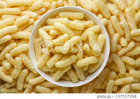 Corn sticks in a plate background. Top view Corn sticks in a plate background. Top view 137537398