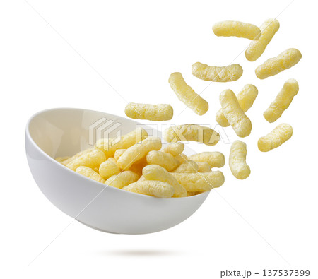 Corn sticks flying out of a plate close-up on a white. Isolated Corn sticks flying out of a plate close-up on a white. Isolated 137537399