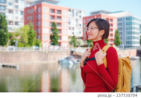 Tourist woman explores modern Frankfurt, Tourist woman explores modern Frankfurt, 137538704