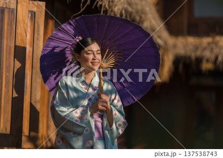 woman in yukata (kimono dress) holding umbrella 137538743
