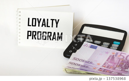 A notebook with the inscription Loyalty program with a calculator and euro banknotes A notebook with the inscription Loyalty program with a calculator and euro banknotes 137538968