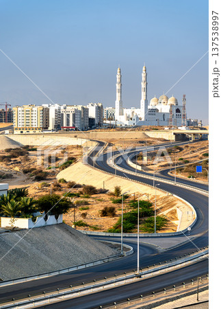 Scenic view of the iconic Mohammed Al Ameen Mosque overlooking modern highway infrastructure in Bawshar, Muscat, Oman in the Middle East Scenic view of the iconic Mohammed Al Ameen Mosque overlooking modern highway infrastructure in Bawshar, Muscat, Oman in the Middle East 137538997