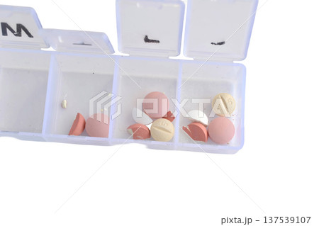A pillbox or container designed to organize and store medications A pillbox or container designed to organize and store medications 137539107