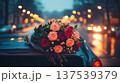 Open car trunk with flower bouquet at night city lights, romantic surprise and love story concept 137539379