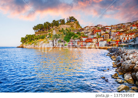 Parga, Greece. Picturesque coastal town in Epirus region, sunrise golden hour and colorful houses. Parga, Greece. Picturesque coastal town in Epirus region, sunrise golden hour and colorful houses. 137539507