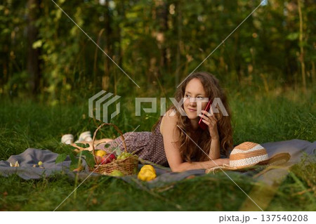 Artist juggling sketching and phone call at picnic Artist juggling sketching and phone call at picnic 137540208