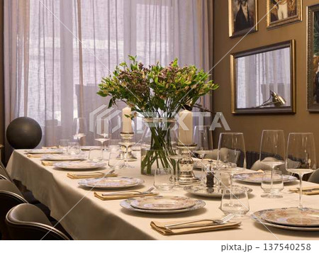 Delicate flower arrangement set for upscale event or gathering 137540258