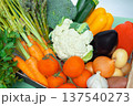 Closeup of assorted fresh vegetables including tomatoes, cauliflower, onions, garlic, carrots, eggplant and potatoes,broccoli. 137540273