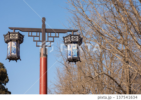 Traditional chinese lanterns on street pole under blue sky 137541634