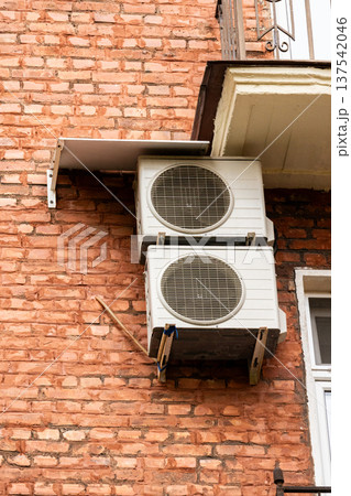 air conditioning on facade of building, air cooling in hot weather.  137542046