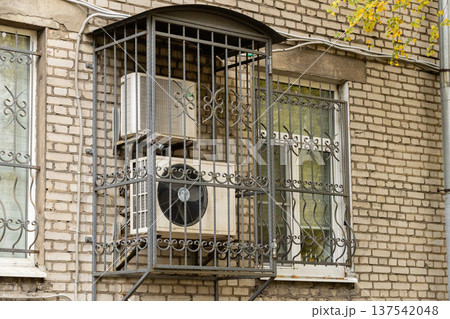 air conditioning on facade of building, air cooling in hot weather.  137542048