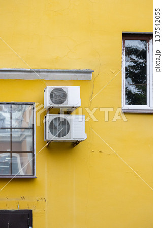 air conditioning on facade of building, air cooling in hot weather.  137542055