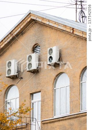 air conditioning on facade of building, air cooling in hot weather.  137542056