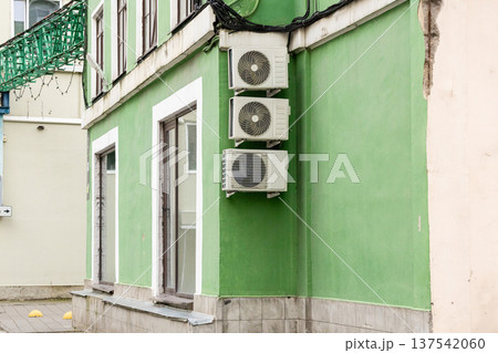 air conditioning on facade of building, air cooling in hot weather.  137542060