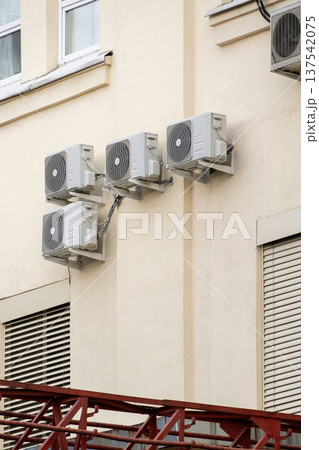 air conditioning on facade of building, air cooling in hot weather.  137542075